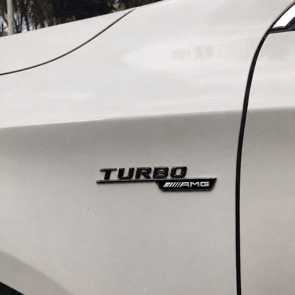 Emblema TURBO AMG para aletas laterales negro brillo con AMG cromado