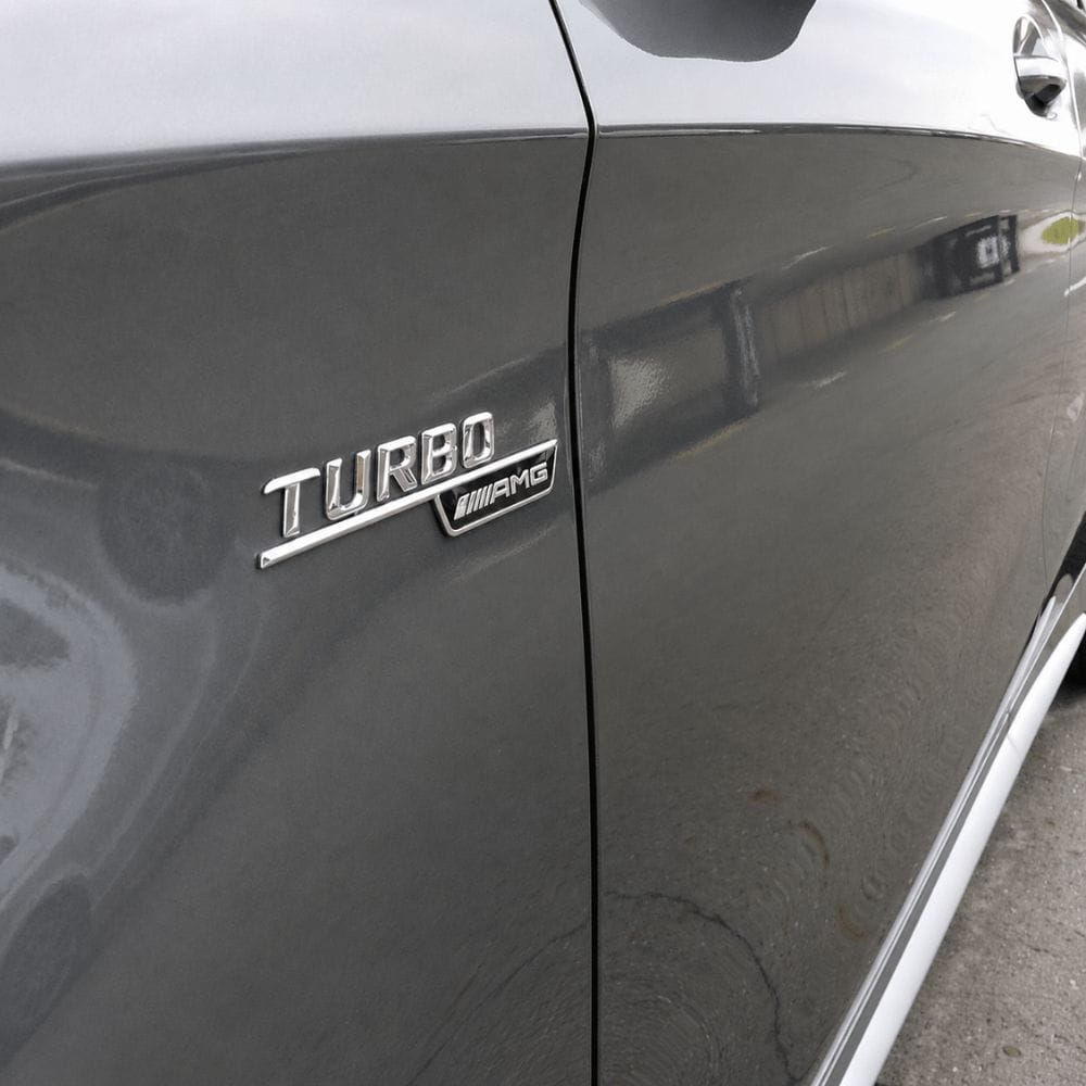 Emblema TURBO AMG para aletas laterales cromado con AMG cromado